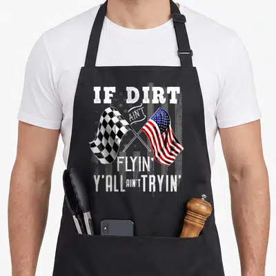 Dirt stock aprons - Crossed checkered and American flags with distressed racing slogan text — shown on a black cotton canvas apron against a white background