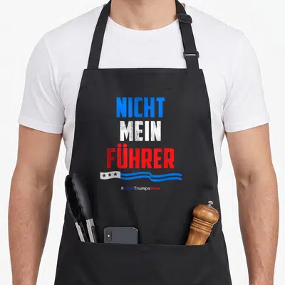 Nicht german apron - Distressed NICHT MEIN FÜHRER text in blue white red with wavy ribbon and #LoveTrumpsHate — shown on a black cotton canvas apron against a white background
