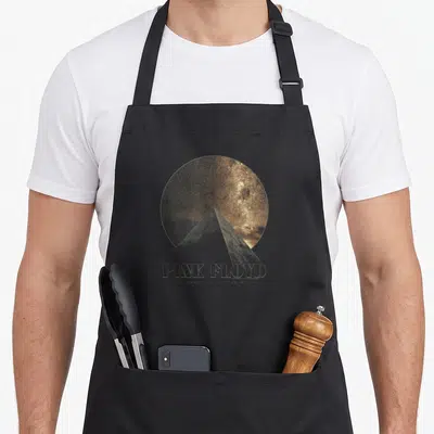 Pyramid pink floyd apron - Gold prism over black starry circle with PINK FLOYD text — shown on a black cotton canvas apron against a white background