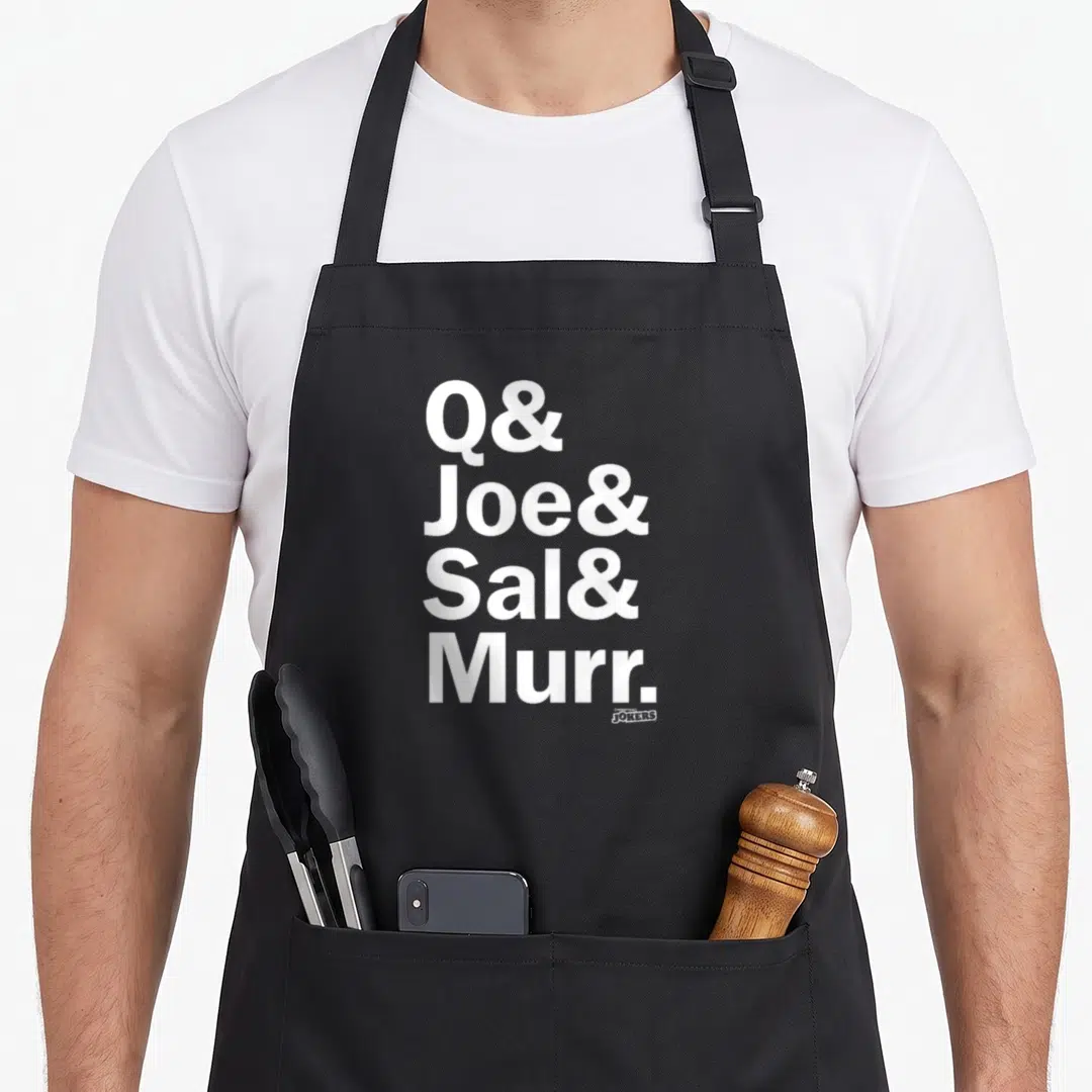 Joe fools apron - White stacked text Q Joe Sal Murr with small Impractical Jokers logo — shown on a black cotton canvas apron against a white background