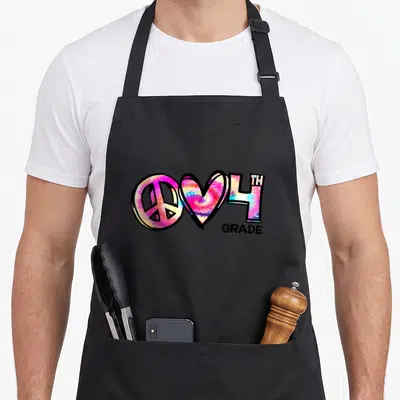 Tie art teacher aprons - Tie-dye peace symbol, heart, and 4TH GRADE text in pink blue yellow — shown on a black cotton canvas apron against a white background