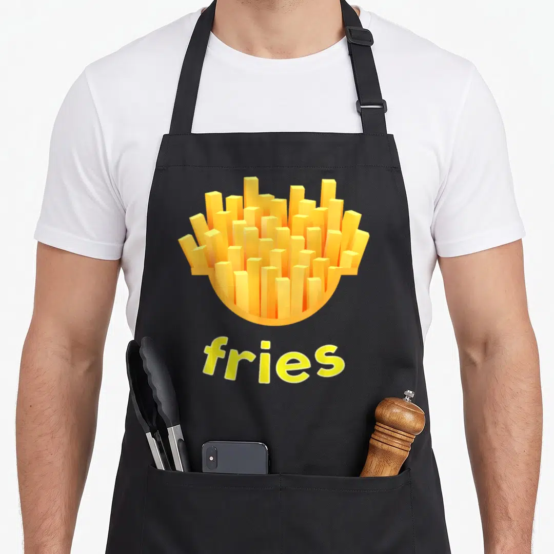 Shirtzilla french apron - Cartoon yellow and orange french fries container above the word fries — shown on a black cotton canvas apron against a white background