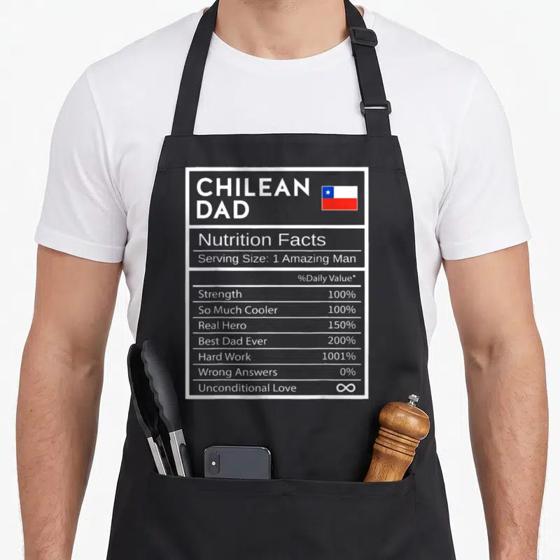 Chilean pride apron - Nutrition facts label graphic for Chilean Dad with flag and white text on dark background — shown on a black cotton canvas apron against a white background