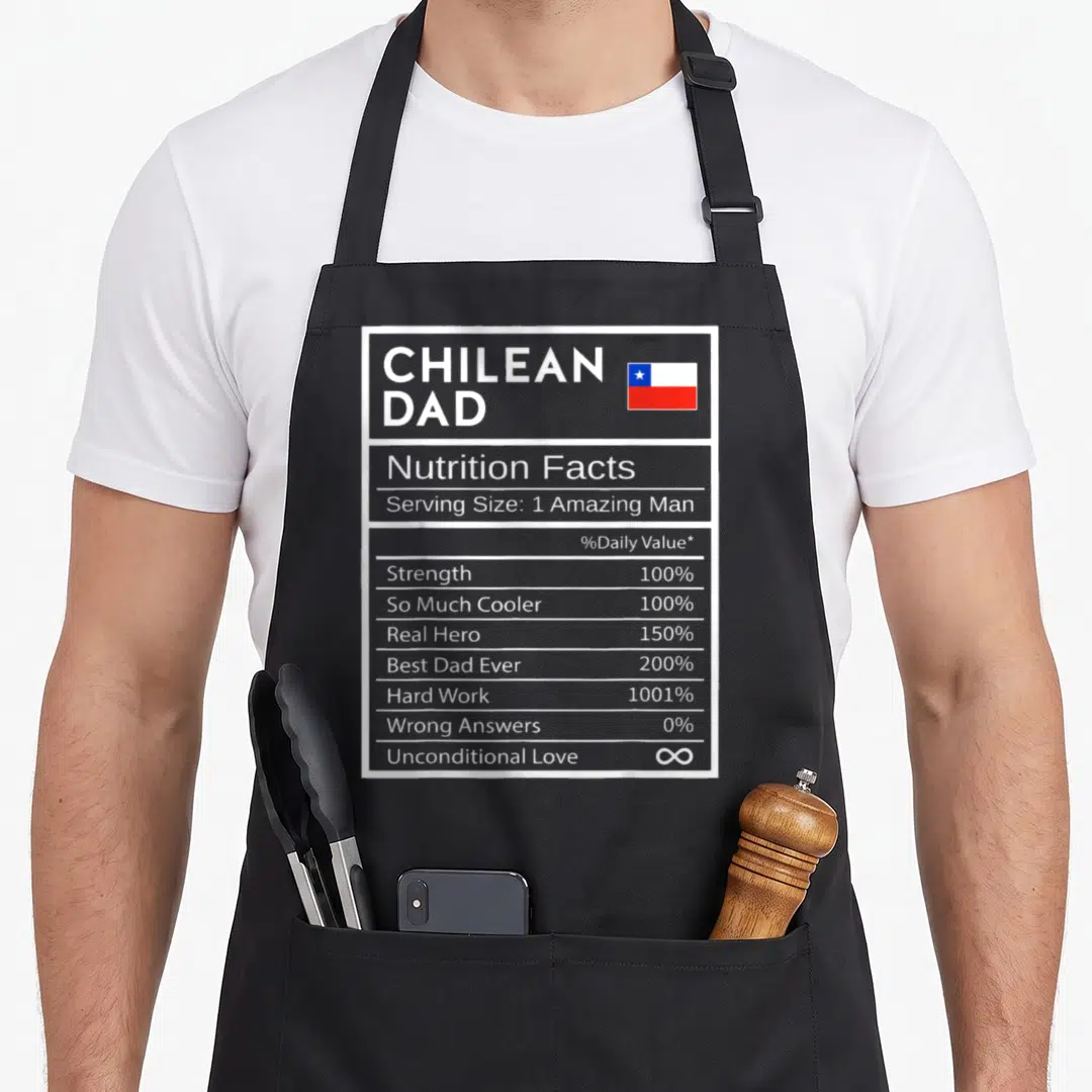 Chilean pride apron - Nutrition facts label graphic for Chilean Dad with flag and white text on dark background — shown on a black cotton canvas apron against a white background