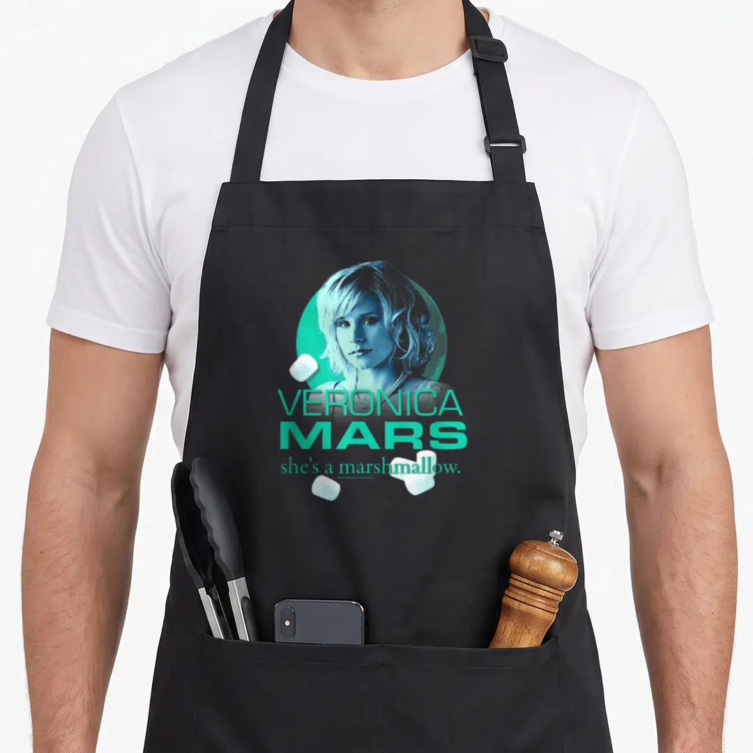 Marshmallow mars apron - Blue woman portrait in teal circle with three white marshmallows and stacked text — shown on a black cotton canvas apron against a white background