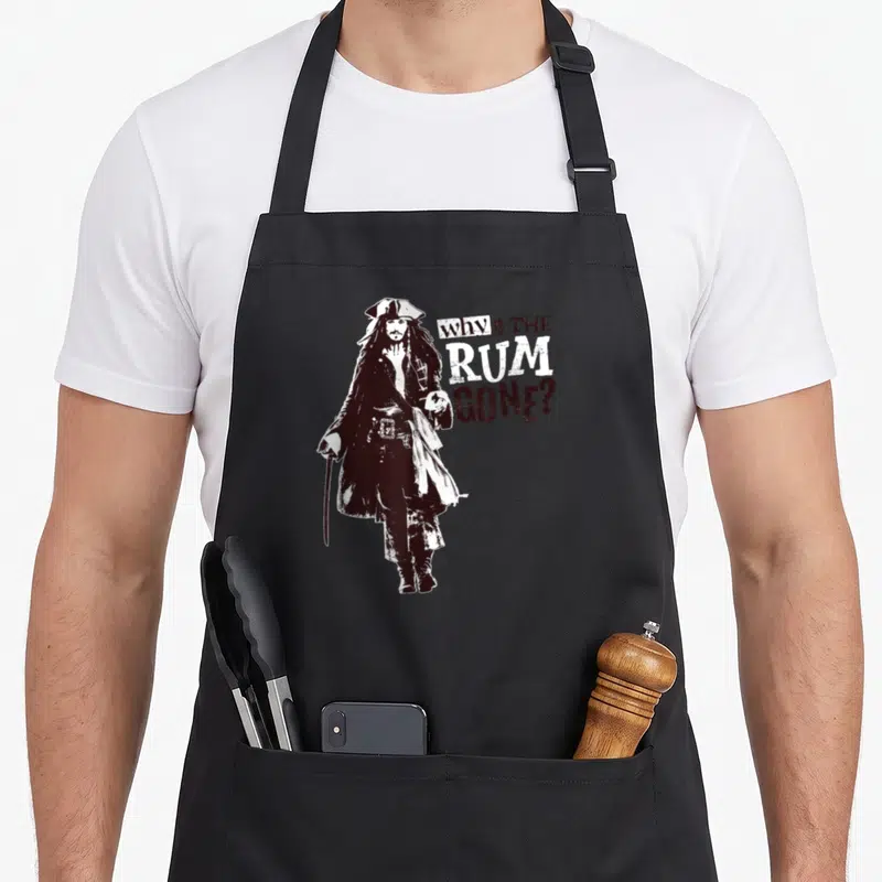 Caribbean sparrows sparrow apron - Pirate figure beside Why Is The Rum Gone text in distressed black and white — shown on a black cotton canvas apron against a white background