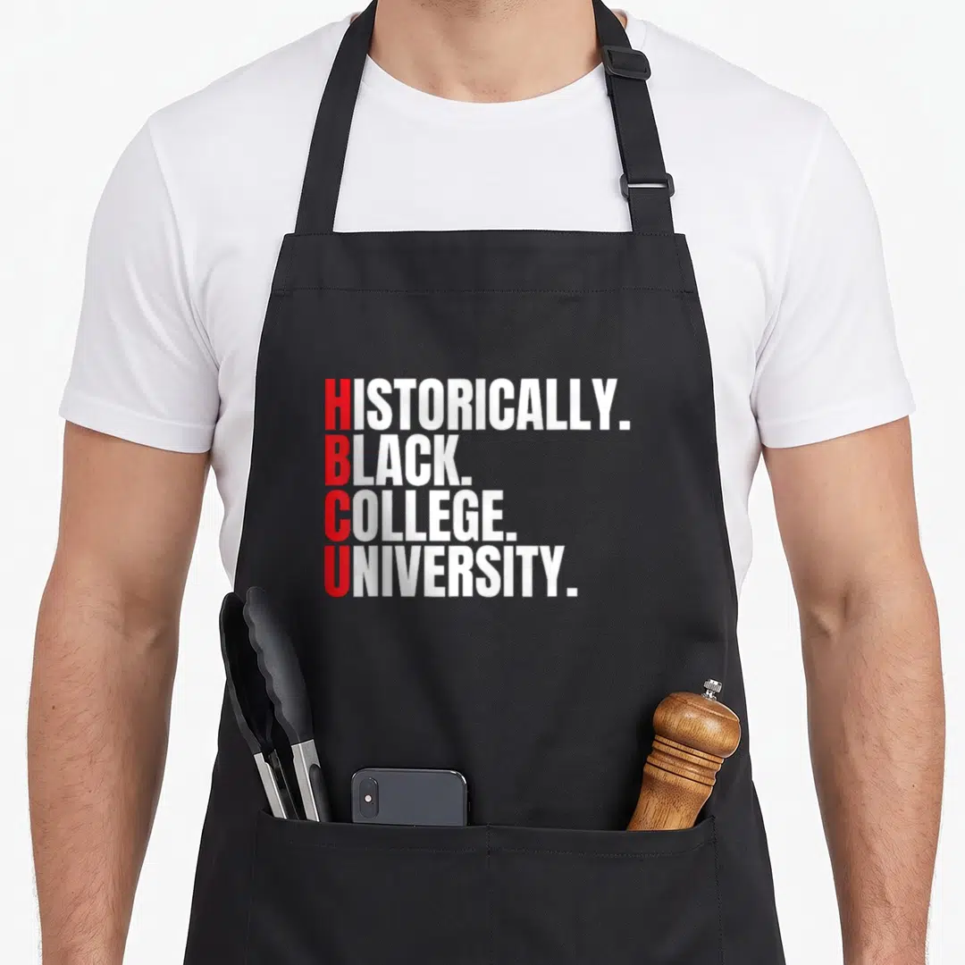 Hbcu historically college apron - Stacked red and white text reading HISTORICALLY BLACK COLLEGE UNIVERSITY — shown on a black cotton canvas apron against a white background