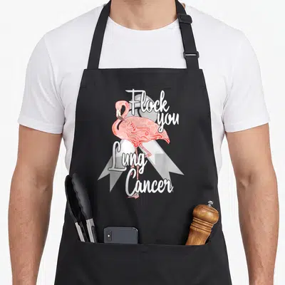 Flock flamingo apron - Pink flamingo over white ribbon with Flock you Lung Cancer text — shown on a black cotton canvas apron against a white background