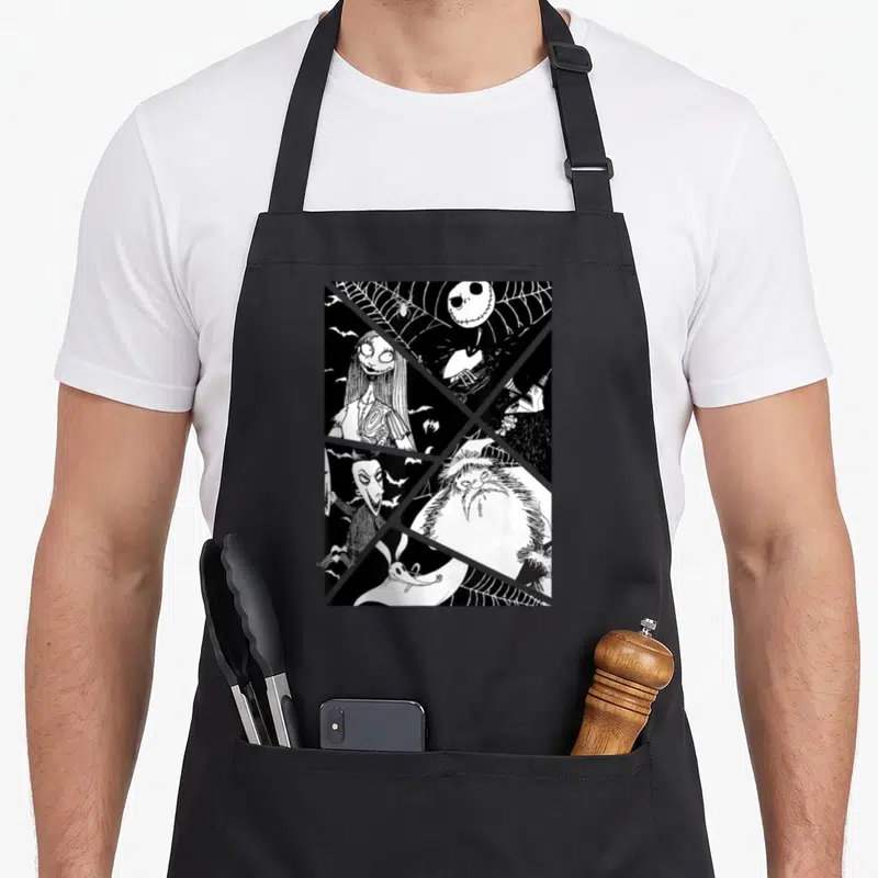 Jack santa apron - Black and white line art collage of Jack Skellington, Sally, Oogie Boogie, Mayor, and Zero separated — shown on a black cotton canvas apron against a white background