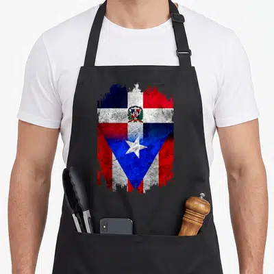 Puerto dominican apron - Distressed red white blue flag merging Dominican coat of arms and Puerto Rican star — shown on a black cotton canvas apron against a white background