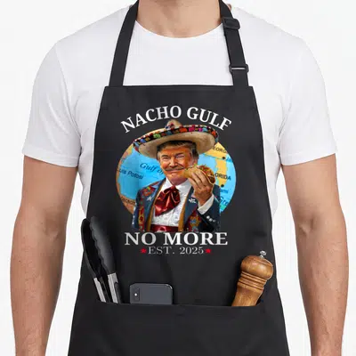 Nacho president humor apron - Portrait of man in sombrero holding taco with text Nacho Gulf No More Est 2025 — shown on a black cotton canvas apron against a white background