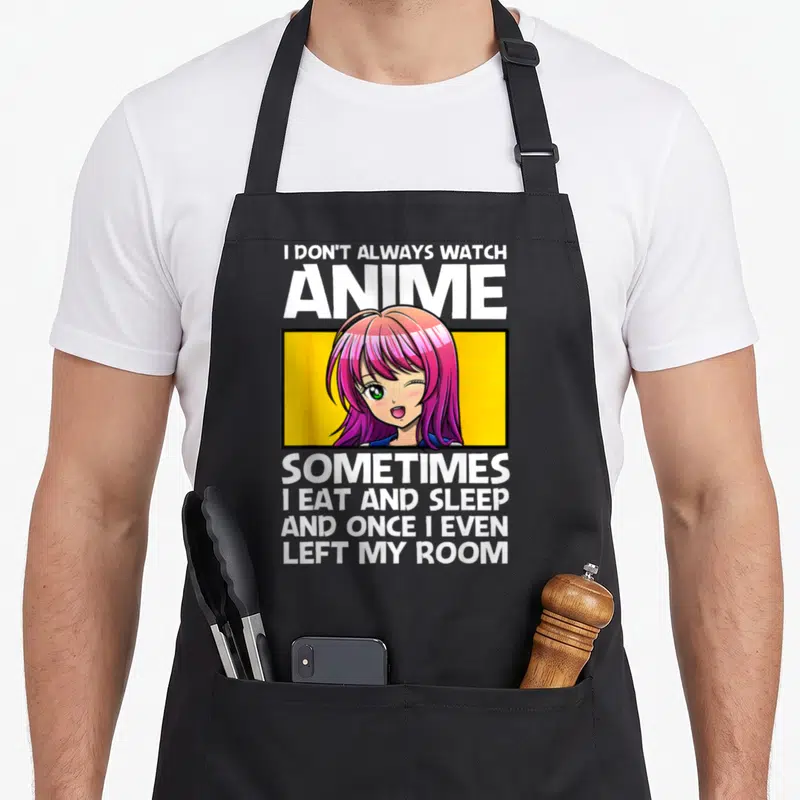 Cute anime apron - Anime girl in yellow box with white text about watching anime and leaving the room — shown on a black cotton canvas apron against a white background