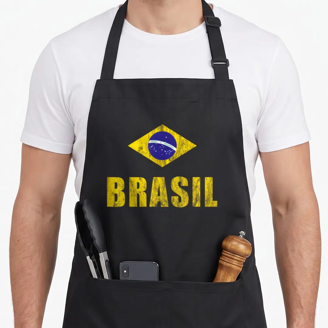 Brasil brazil philodendron apron - Distressed yellow and blue Brazilian flag with ORDEM E PROGRESSO text above large — shown on a black cotton canvas apron against a white background