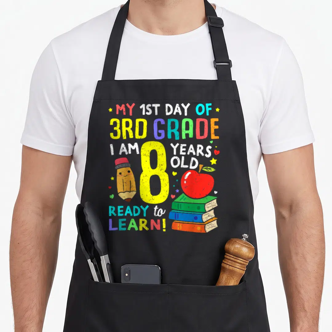 School grade apron - Yellow 8 with pencil books apple and My 1st Day of 3rd Grade text — shown on a black cotton canvas apron against a white background