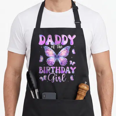 Daddy birthday butterfly aprons - Purple watercolor butterfly with Daddy of the Birthday Girl text and four smaller — shown on a black cotton canvas apron against a white background