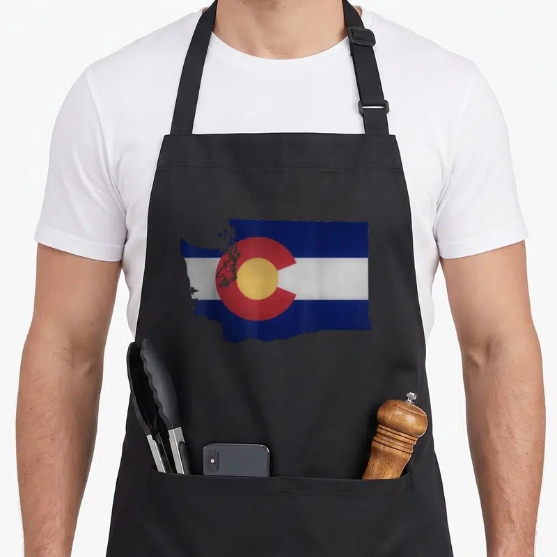 Colorado washington pride apron - Washington state map outline filled with Colorado flag blue white red yellow stripes — shown on a black cotton canvas apron against a white background