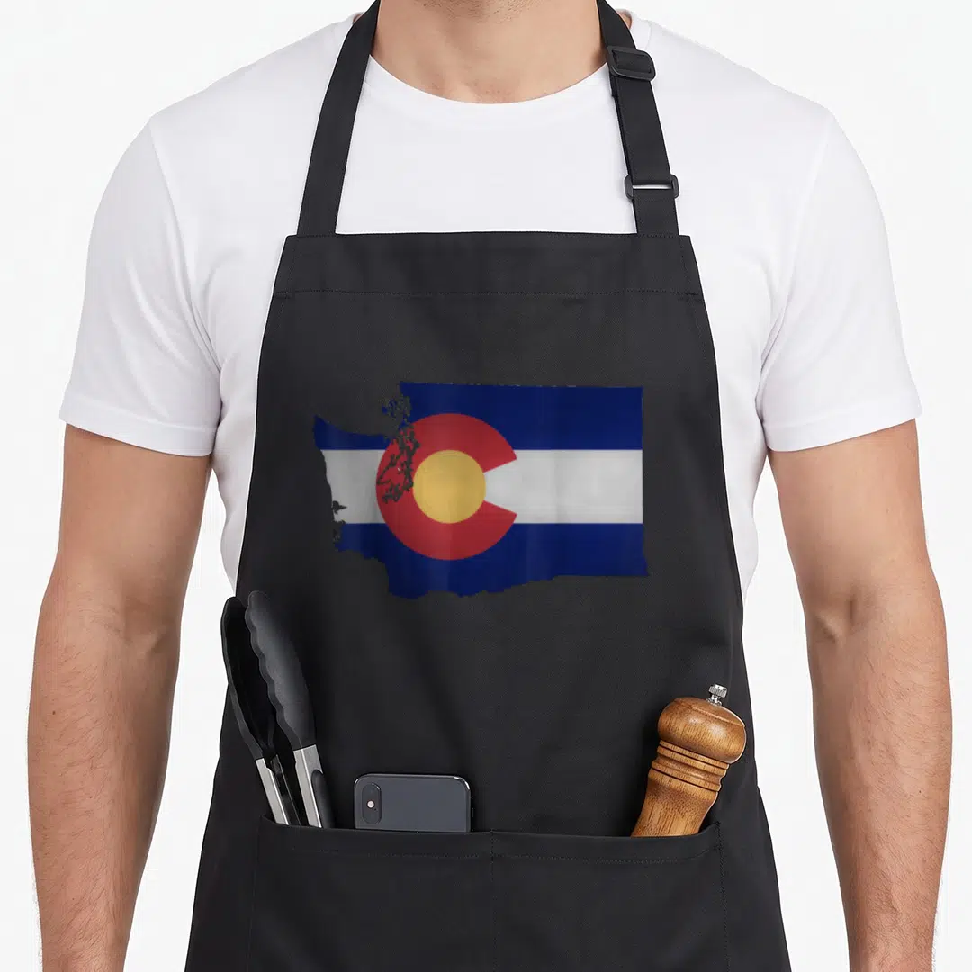 Colorado washington pride apron - Washington state map outline filled with Colorado flag blue white red yellow stripes — shown on a black cotton canvas apron against a white background