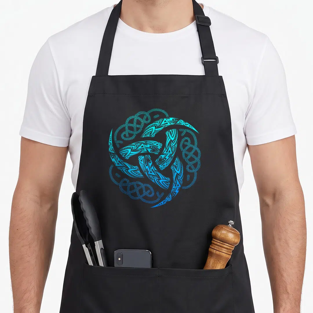 Celtic viking apron - Cyan and blue triple horn triskelion surrounded by celtic knotwork line art — shown on a black cotton canvas apron against a white background