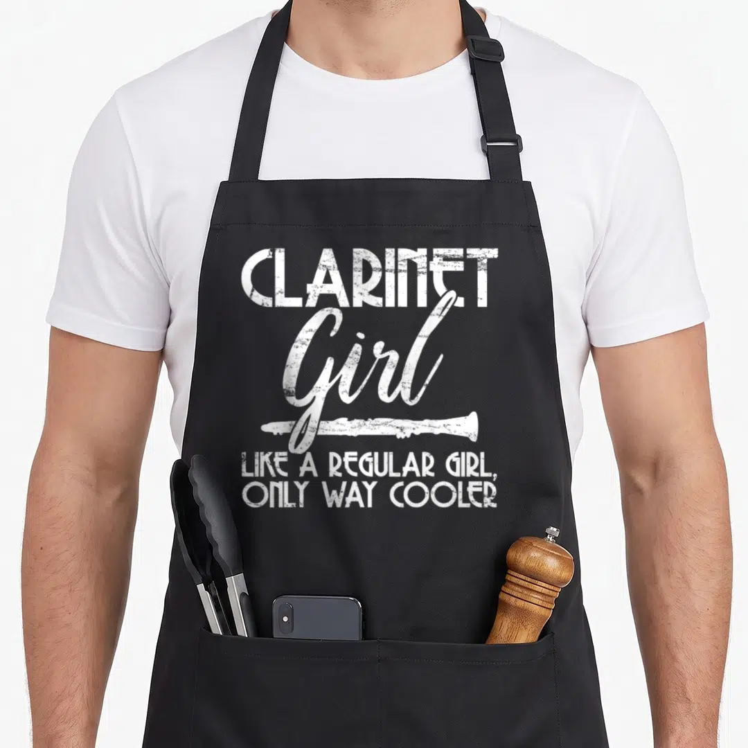 Music clarinet apron - White distressed text reading CLARINET Girl Like a Regular Girl Only Way Cool with horizontal — shown on a black cotton canvas apron against a white background