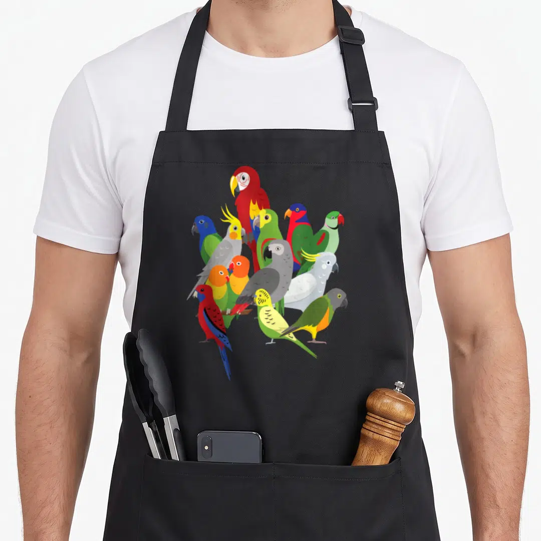 Herd crazy parrot man apron - Ten colorful parrots perched on a brown branch in red blue yellow green and grey — shown on a black cotton canvas apron against a white background