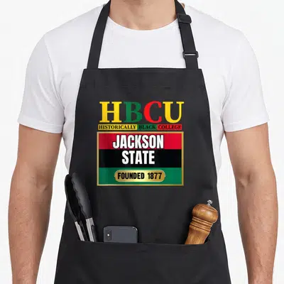 Jsu state university apron - HBCU typography with red black and green stripes and gold border reading Jackson State — shown on a black cotton canvas apron against a white background