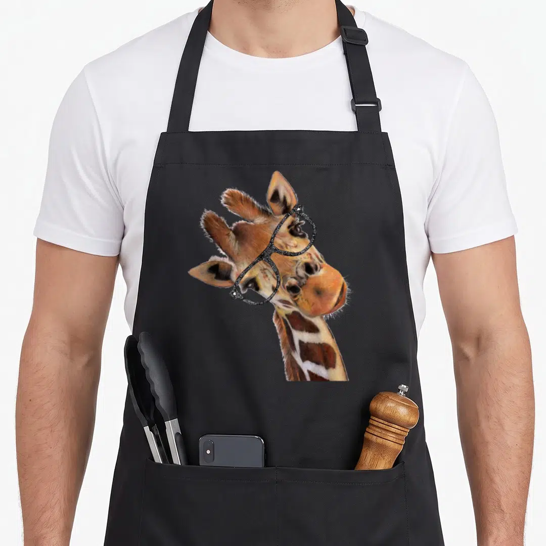 Hipster giraffe apron - Realistic giraffe head and neck wearing black glasses on black fabric — shown on a black cotton canvas apron against a white background