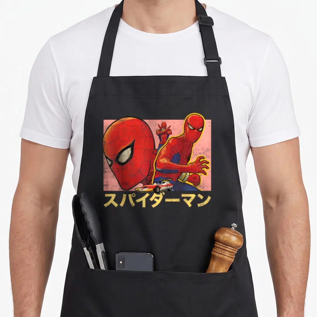 Collage spider apron - Three Spider-Man poses and race car on pink background with Japanese text — shown on a black cotton canvas apron against a white background