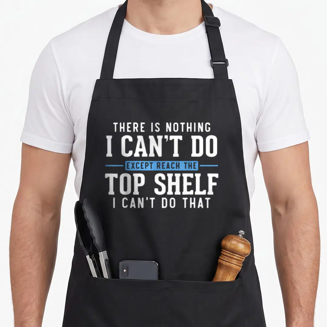 Reach best friend aprons - Stacked white text reading top shelf except reach the inside blue banner sarcasm — shown on a black cotton canvas apron against a white background