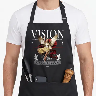 Modern streetwear apron - Angel with red cloth and two doves below large VISION text and inspirational quote — shown on a black cotton canvas apron against a white background