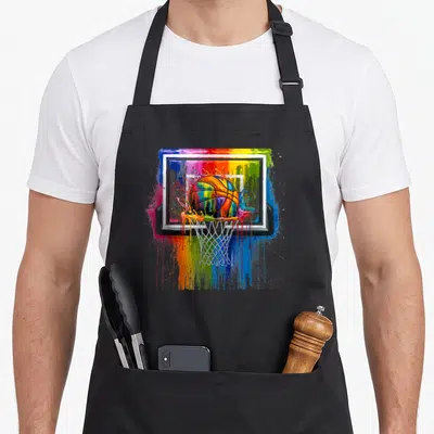 Paint tie-dye apron - Multicolored basketball falling through hoop with paint dripping down backboard in watercolor — shown on a black cotton canvas apron against a white background