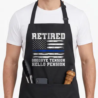 Policeman retirement apron - Distressed white and blue flag with retired goodbye tension hello pension text — shown on a black cotton canvas apron against a white background