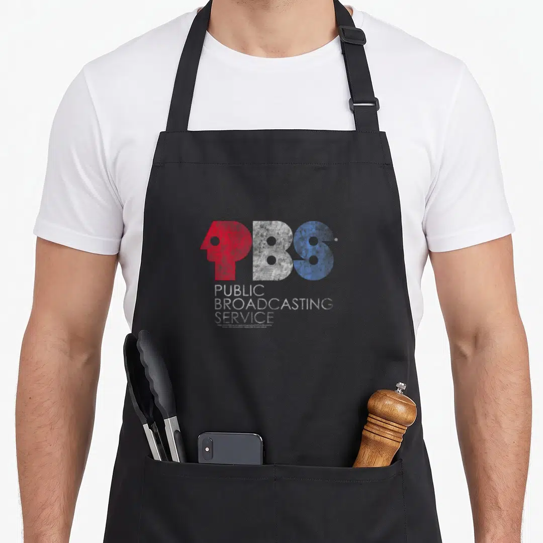 Pbs service apron - Distressed PBS logo in red, white, and blue with stacked text — shown on a black cotton canvas apron against a white background
