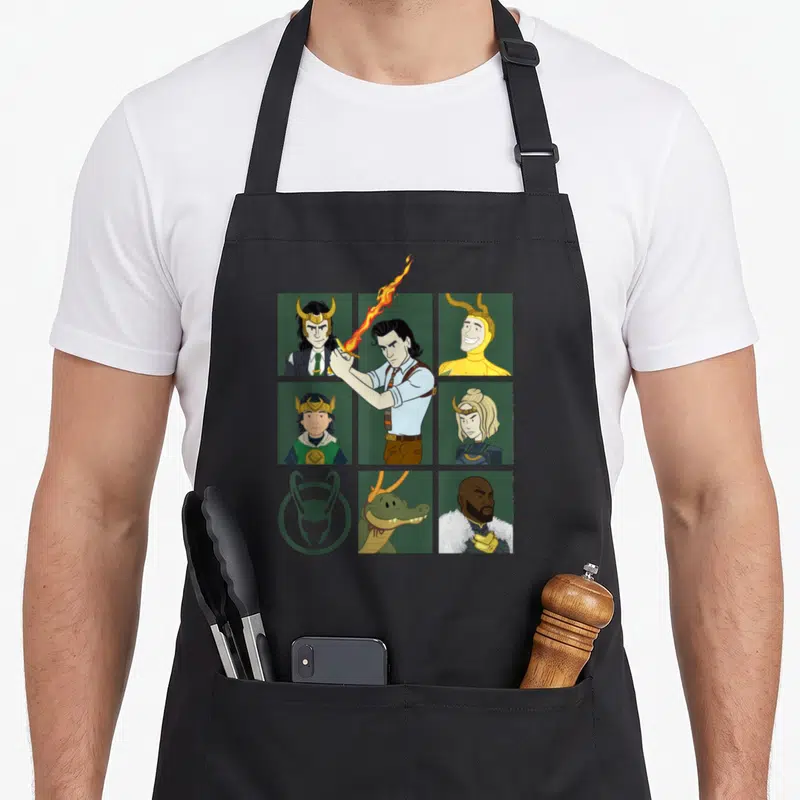 Variant character aprons - Cartoon grid of Loki variants including alligator and Sylvie on black background — shown on a black cotton canvas apron against a white background
