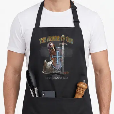 Whole bible study apron - Realistic armor cluster with sword shield helmet and text The Armor of God Ephesians 6:13 — shown on a black cotton canvas apron against a white background