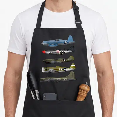 Warplane ww2 apron - Five WWII planes facing left with codes DAPHNE 15 E2 102 LH X DF AI in blue silver olive green tan — shown on a black cotton canvas apron against a white background