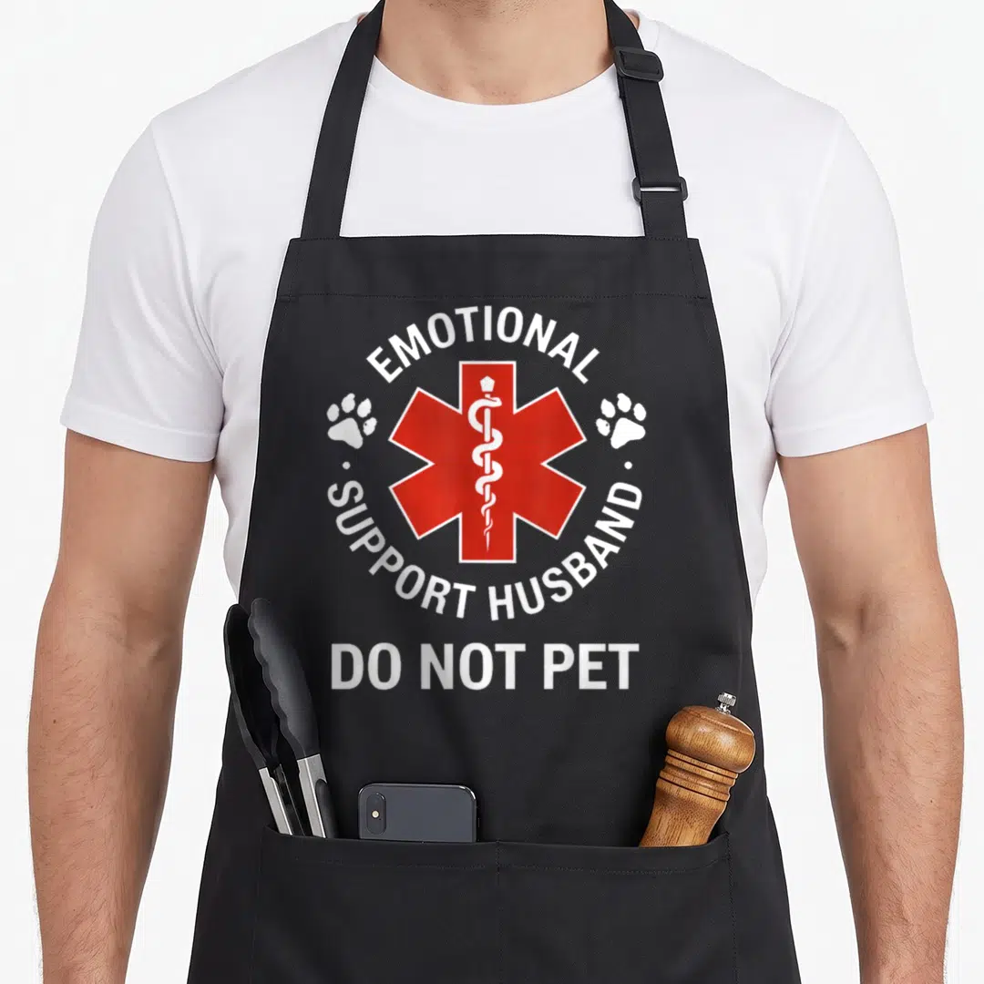 Support husband apron - Red Star of Life with two paw prints and DO NOT PET text — shown on a black cotton canvas apron against a white background