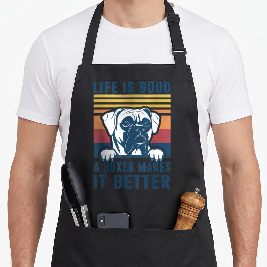 Vintage boxer dog apron - Retro striped boxer dog head and paws with LIFE IS GOOD text in blue lettering — shown on a black cotton canvas apron against a white background