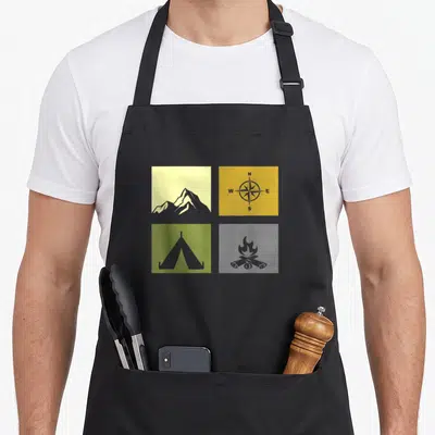 Outdoor hiking camping apron - Four panel grid with yellow mountain, olive tent, and compass showing N W E S directions — shown on a black cotton canvas apron against a white background