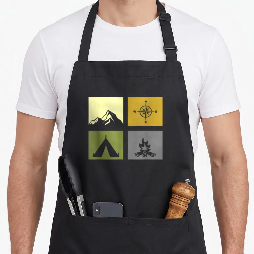 Outdoor hiking camping apron - Four panel grid with yellow mountain, olive tent, and compass showing N W E S directions — shown on a black cotton canvas apron against a white background