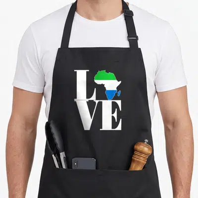 Leone pride apron - White LOVE text with Africa map filled in green white and blue stripes — shown on a black cotton canvas apron against a white background