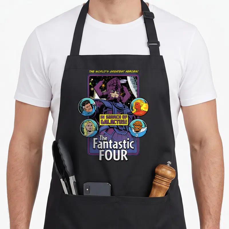 Search step apron - Galactus surrounded by four circular portraits with yellow and white text — shown on a black cotton canvas apron against a white background