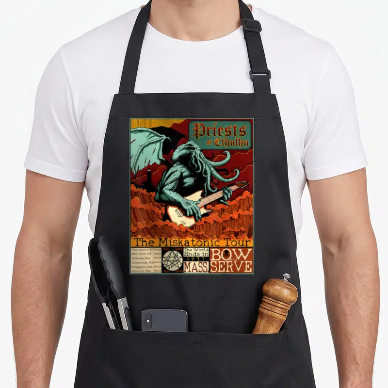 Miskatonic horror apron - Cthulhu playing guitar on orange waves with tour dates and a pentagram skull logo — shown on a black cotton canvas apron against a white background