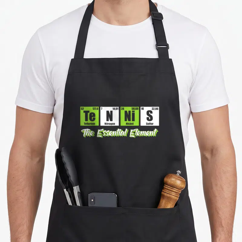 Tennis essential apron - Four periodic table tiles spelling Tennis with The Essential Element text below — shown on a black cotton canvas apron against a white background