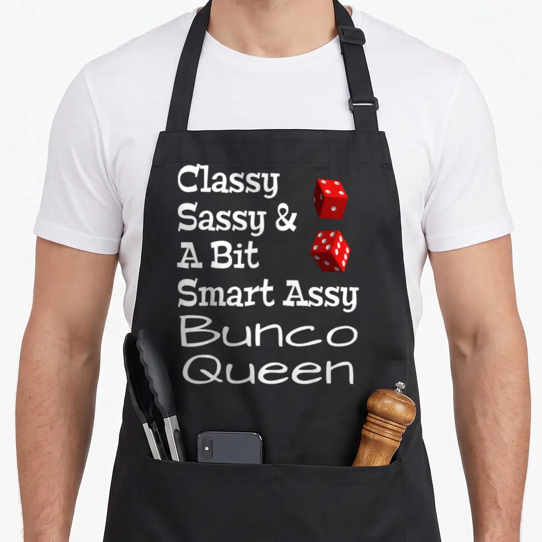 Sassy smart apron - Classy Sassy Bunco Queen text with two red dice stacked vertically — shown on a black cotton canvas apron against a white background