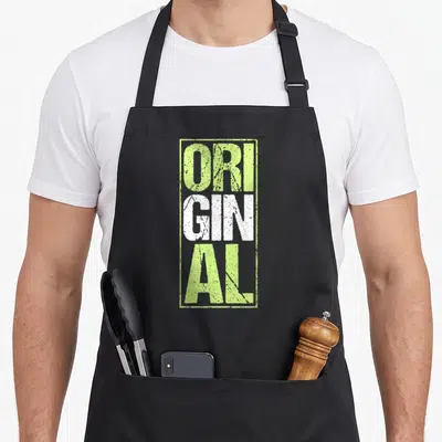 Original cocktail apron - Stacked distressed lime green and white text reading ORI GINAL inside a rectangular border — shown on a black cotton canvas apron against a white background