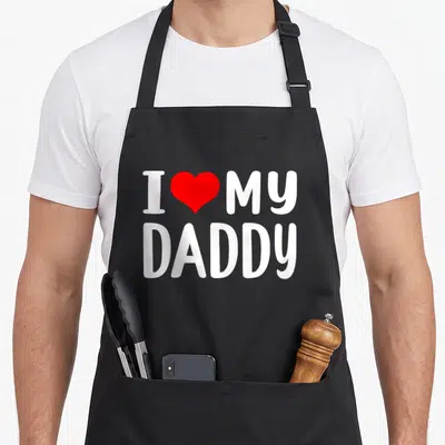 Funny daddy grandad aprons - White text I Love My Daddy with red heart graphic on canvas fabric — shown on a black cotton canvas apron against a white background
