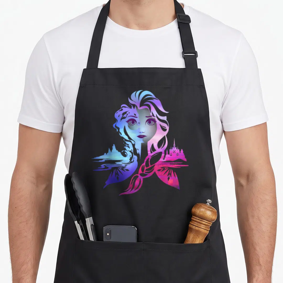 Frozen two tone apron - Woman silhouette filled with blue purple pink landscape of mountains water and castle — shown on a black cotton canvas apron against a white background