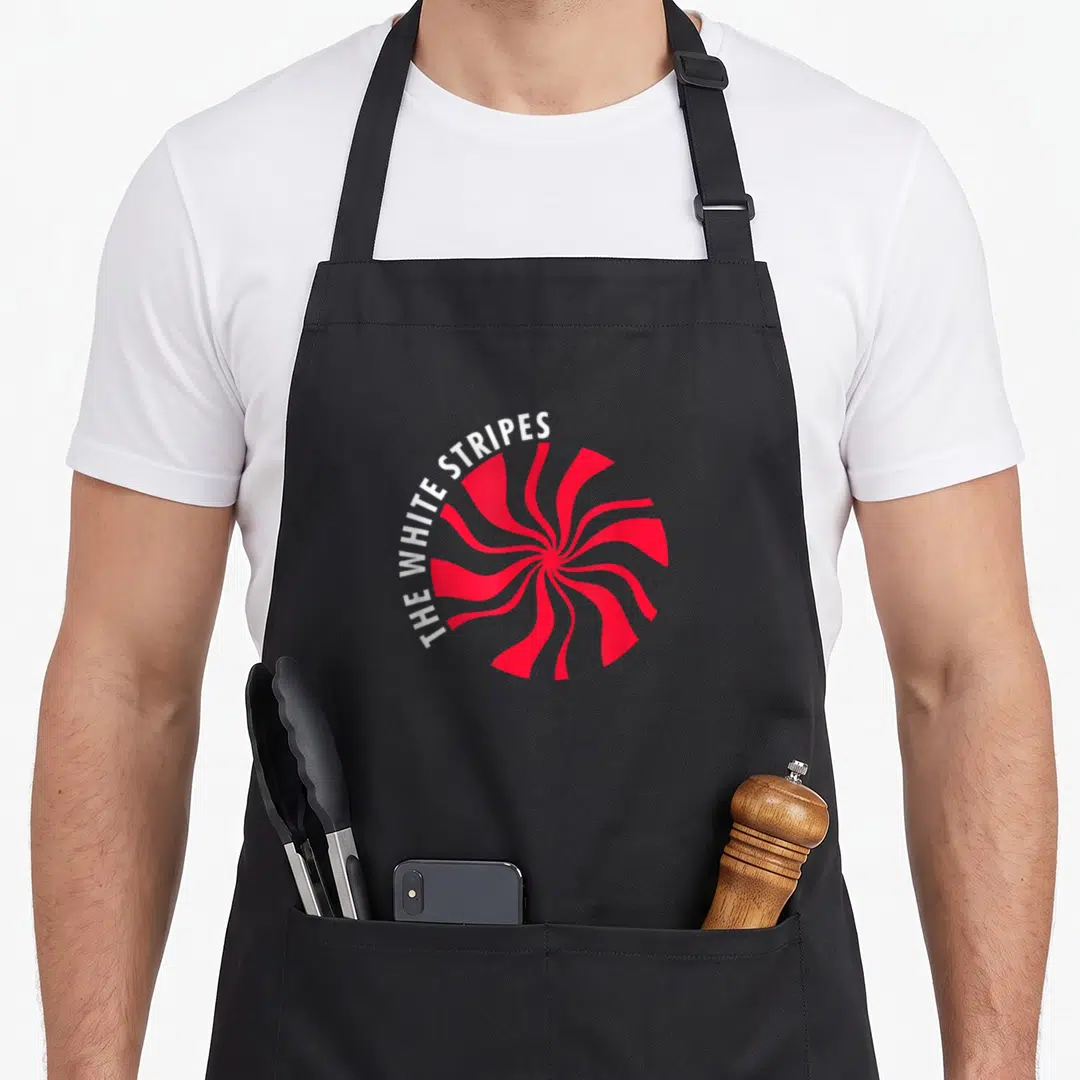 Funny stripe apron - Red spiral graphic with white arched text reading THE WHITE STRIPES — shown on a black cotton canvas apron against a white background