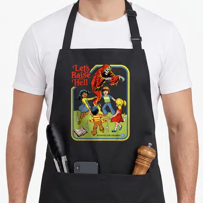 Rhode ghost apron - Grim Reaper above four children holding hands around candles and a book with Let's Raise Hell text — shown on a black cotton canvas apron against a white background