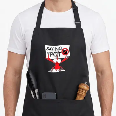 Crawfish lobster apron - Red cartoon lobster holding white sign saying SAY NO TO POT with prohibition symbol — shown on a black cotton canvas apron against a white background